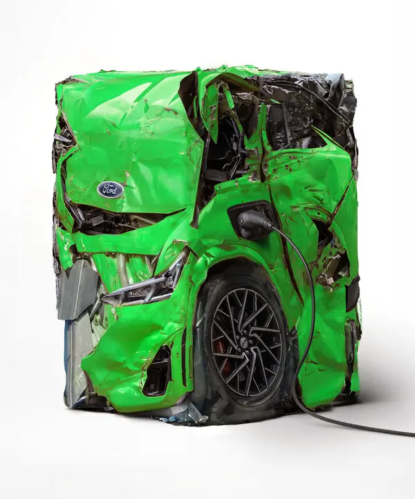 A photo illustration of a
                                bright green auto that has been crushed
                                into a rectangular shape. An E.V. charge
                                cable is plugged into one side; a Ford
                                emblem is clearly visible on its hood.